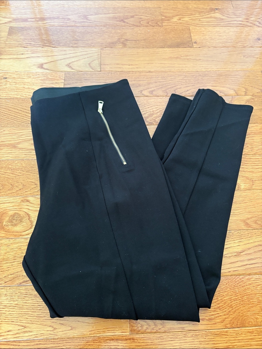 Black thick leggings with gold zippers